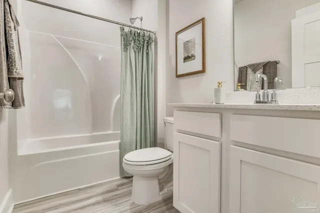 a bathroom with bathtub and shower
