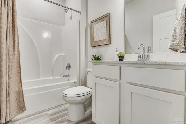 a bathroom with a shower and a toilet