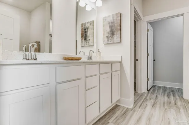 a white bath tub sitting next to a white sink