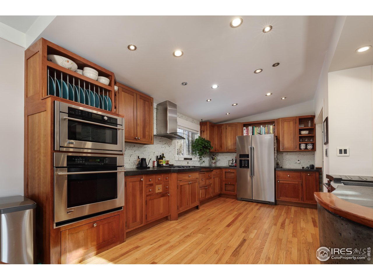 1895 Balsam Avenue Boulder, CO 80304 - Photo 10 of 40 a kitchen with stainless steel appliances granite countertop a refrigerator and a stove top oven