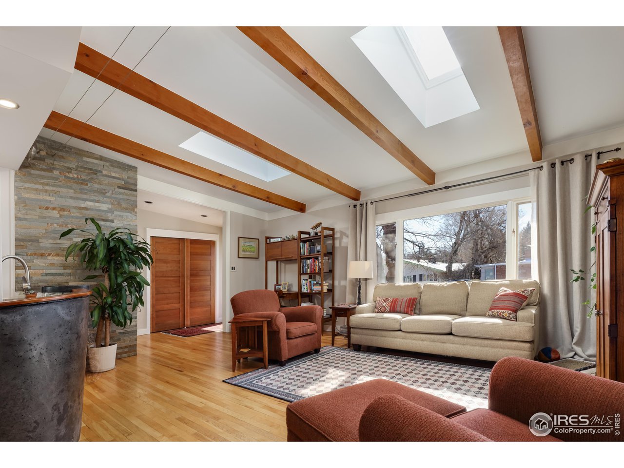 1895 Balsam Avenue Boulder, CO 80304 - Photo 13 of 40 a living room with furniture and a floor to ceiling window