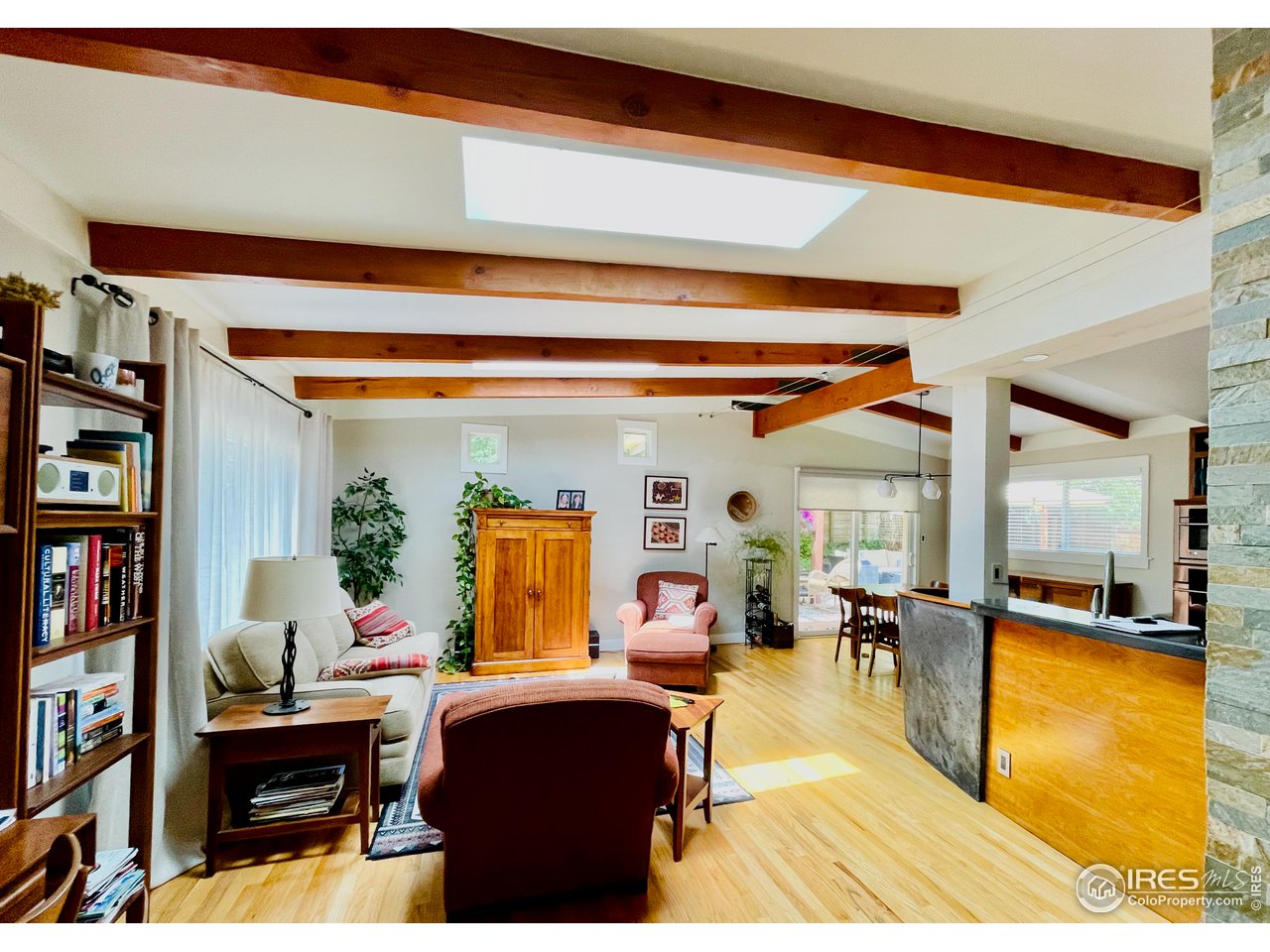 1895 Balsam Avenue Boulder, CO 80304 - Photo 15 of 40 a living room with furniture and a book shelf