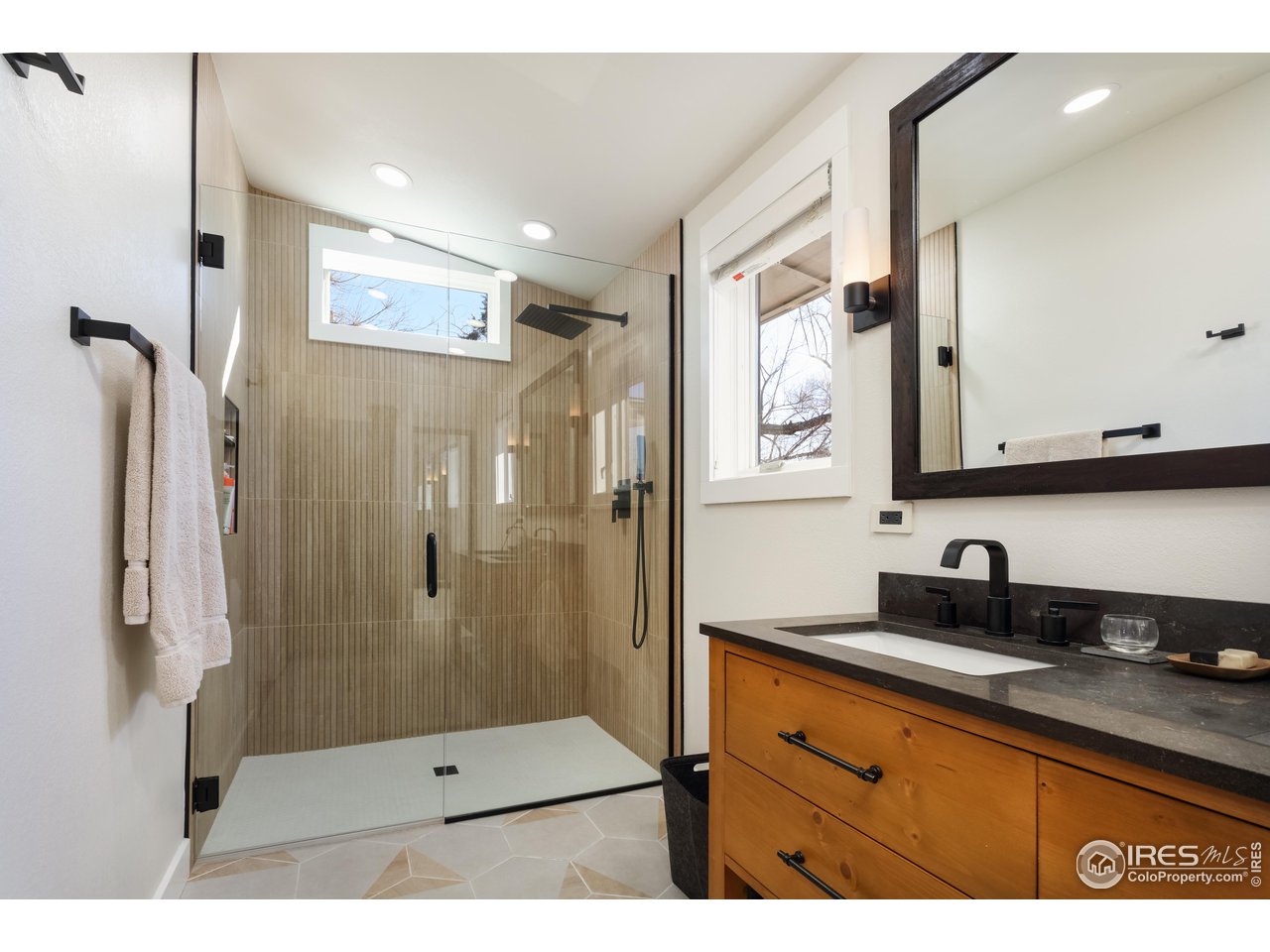 1895 Balsam Avenue Boulder, CO 80304 - Photo 19 of 40 a bathroom with a shower sink and mirror