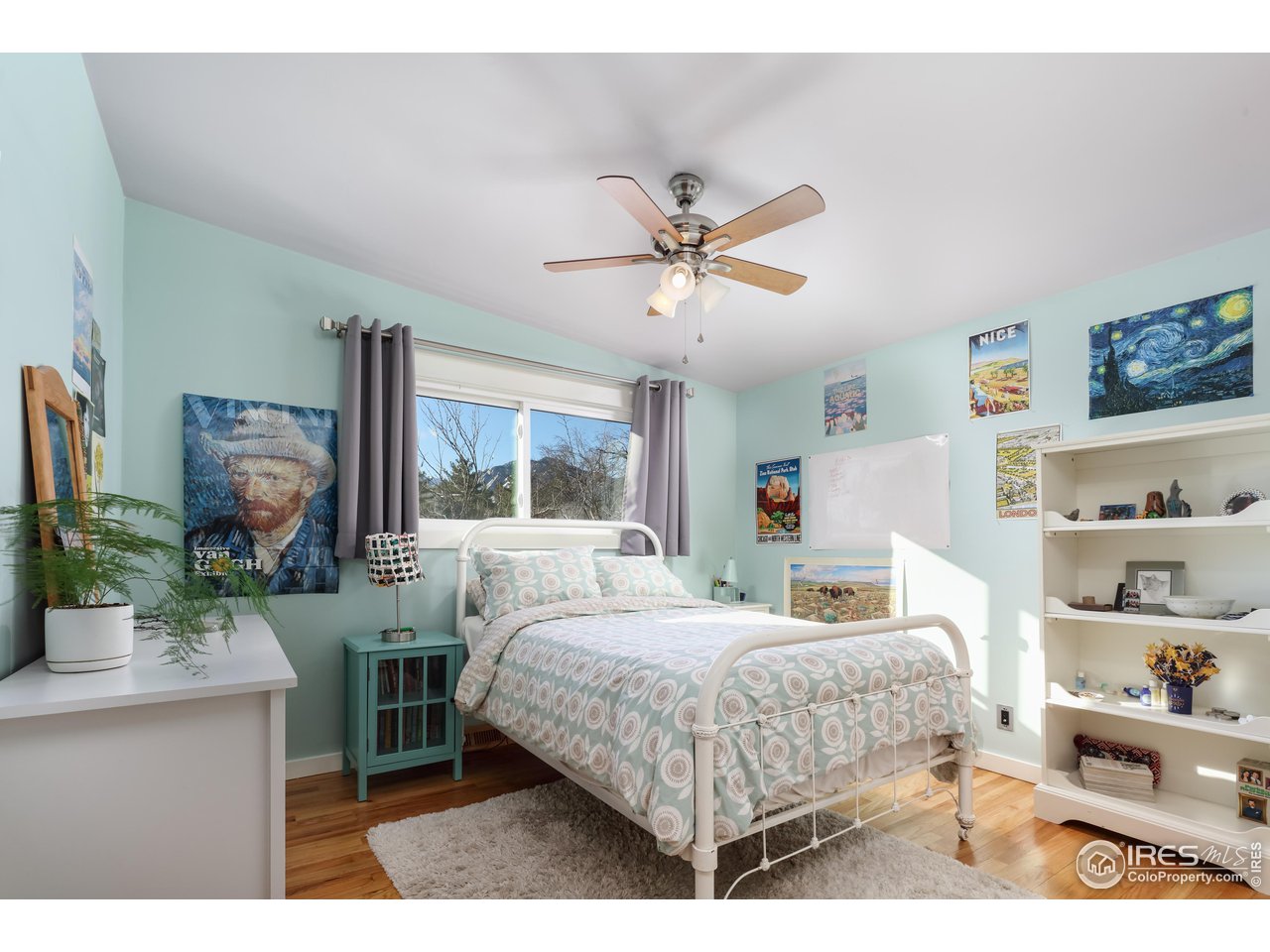 1895 Balsam Avenue Boulder, CO 80304 - Photo 23 of 40 a bedroom with a bed a window and a potted plant