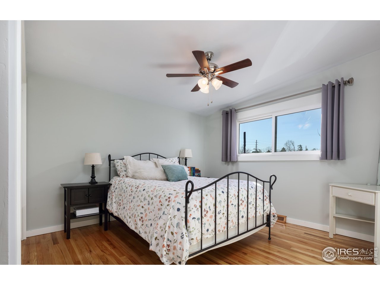 1895 Balsam Avenue Boulder, CO 80304 - Photo 25 of 40 a bedroom with a bed and a painting on the wall
