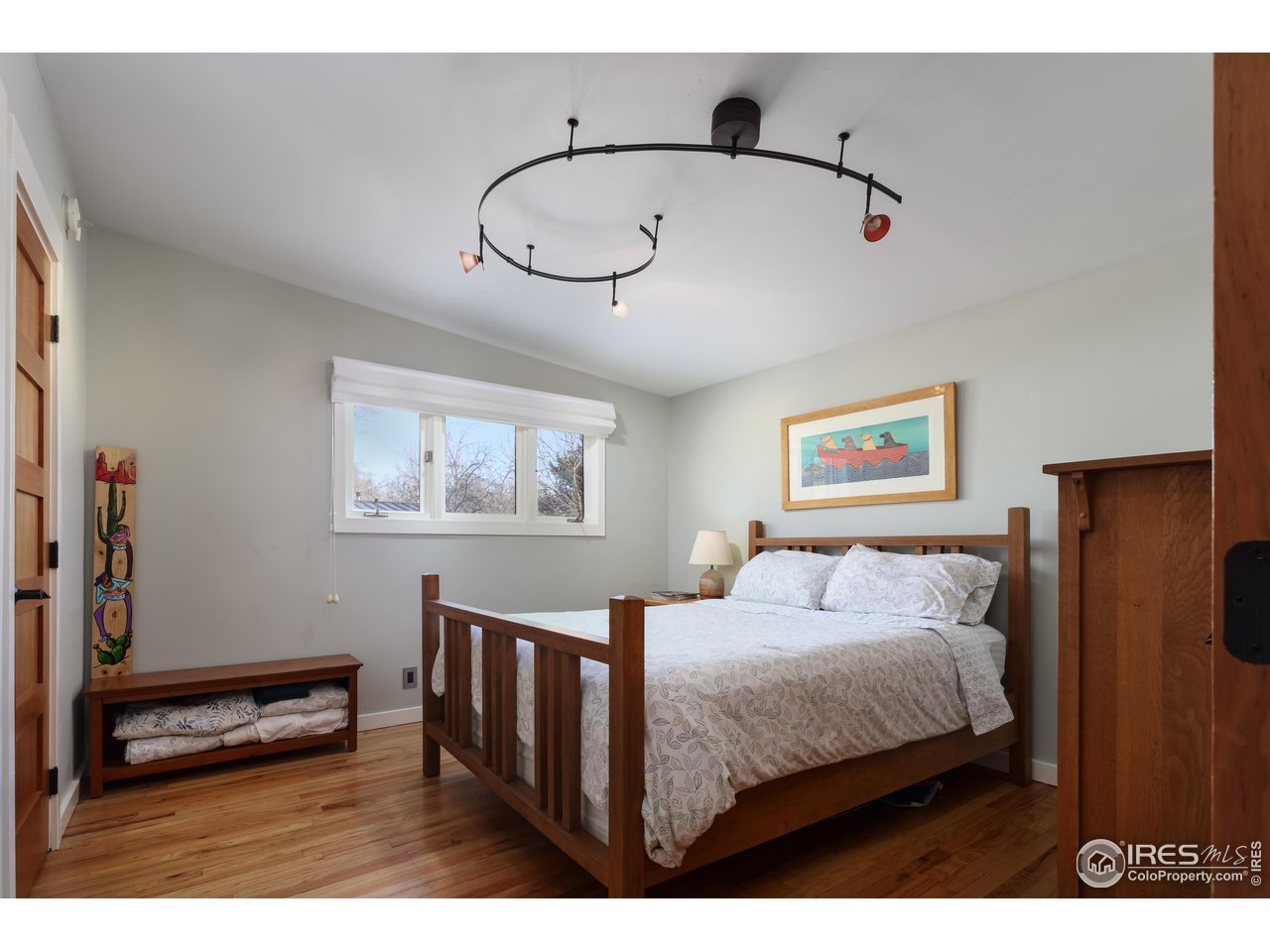 1895 Balsam Avenue Boulder, CO 80304 - Photo 26 of 40 a bedroom with a bed and a painting on the wall