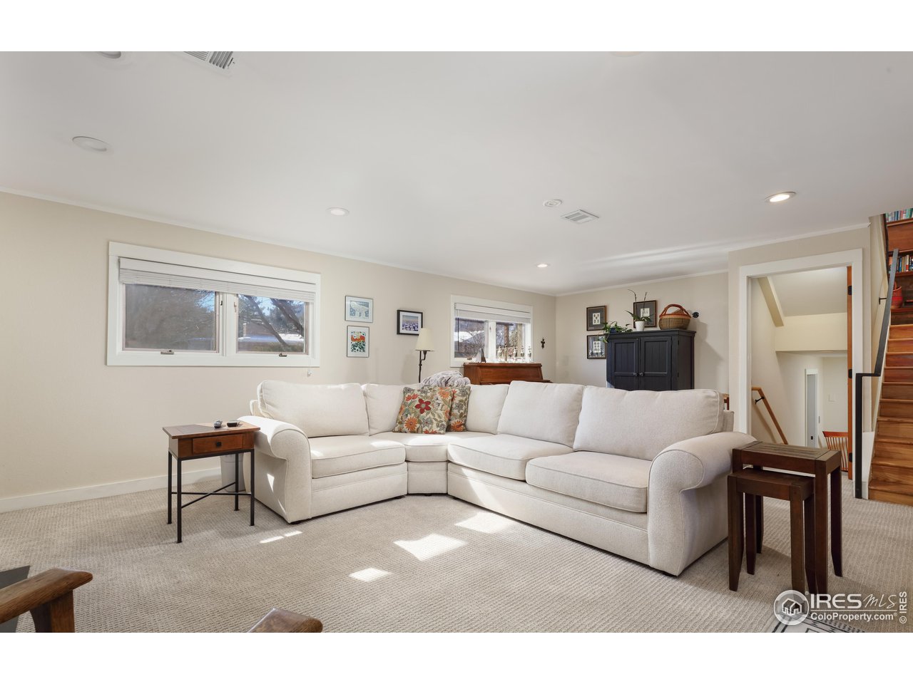 1895 Balsam Avenue Boulder, CO 80304 - Photo 28 of 40 a living room with furniture a wooden floor and a large window