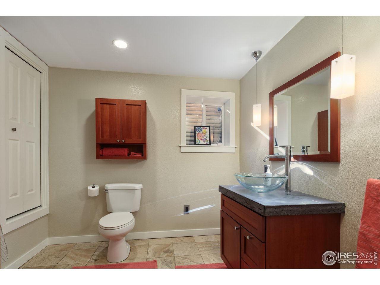 1895 Balsam Avenue Boulder, CO 80304 - Photo 35 of 40 a bathroom with a toilet a sink and mirror