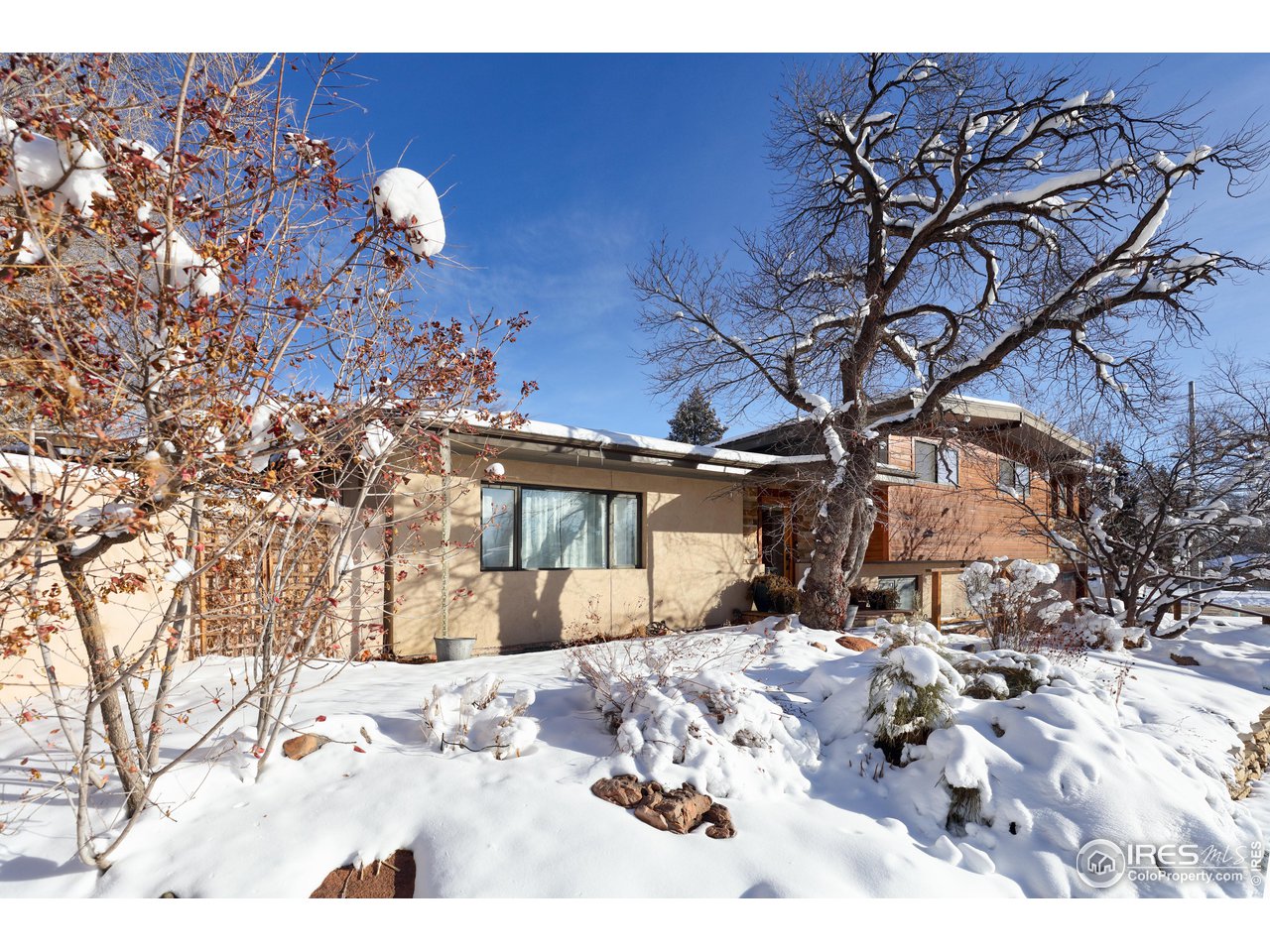 1895 Balsam Avenue Boulder, CO 80304 - Photo 7 of 40 a view of a house with a yard covered in snow