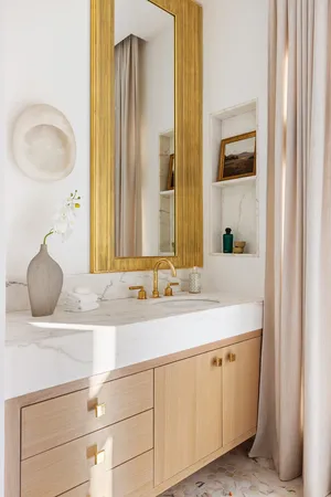 a spacious bathroom with a tub sink and glass door