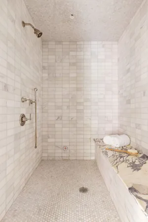 a front view of a building with a garden