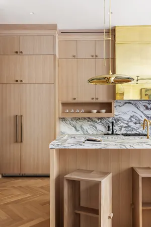 a kitchen with stainless steel appliances granite countertop a sink and a refrigerator