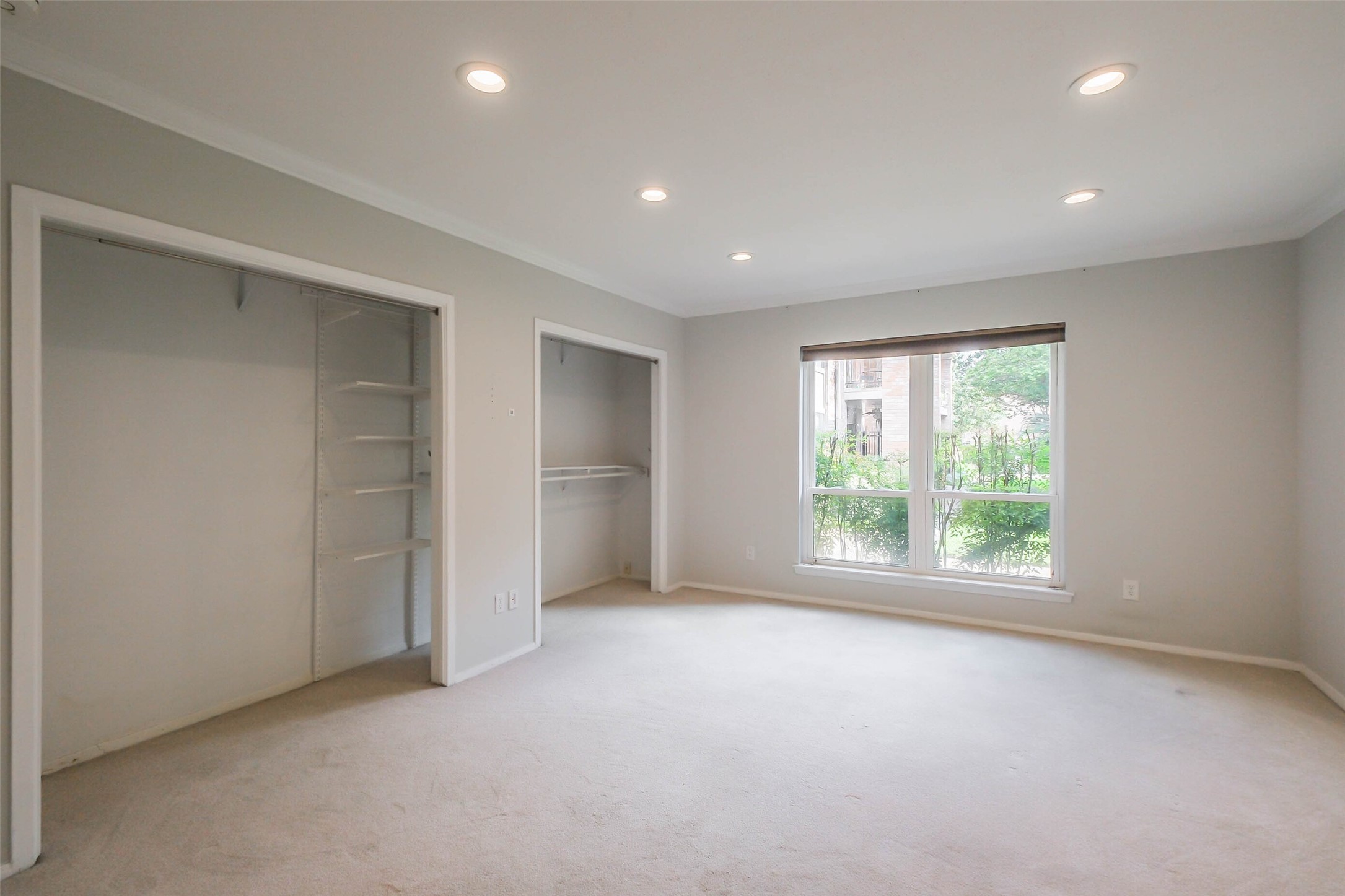 2230 South Piney Point Road, Unit 113 Houston, TX 77063 - Photo 12 of 28 The primary bedroom has carpet floors, recessed lighting, and crown molding. The windows are double pane!