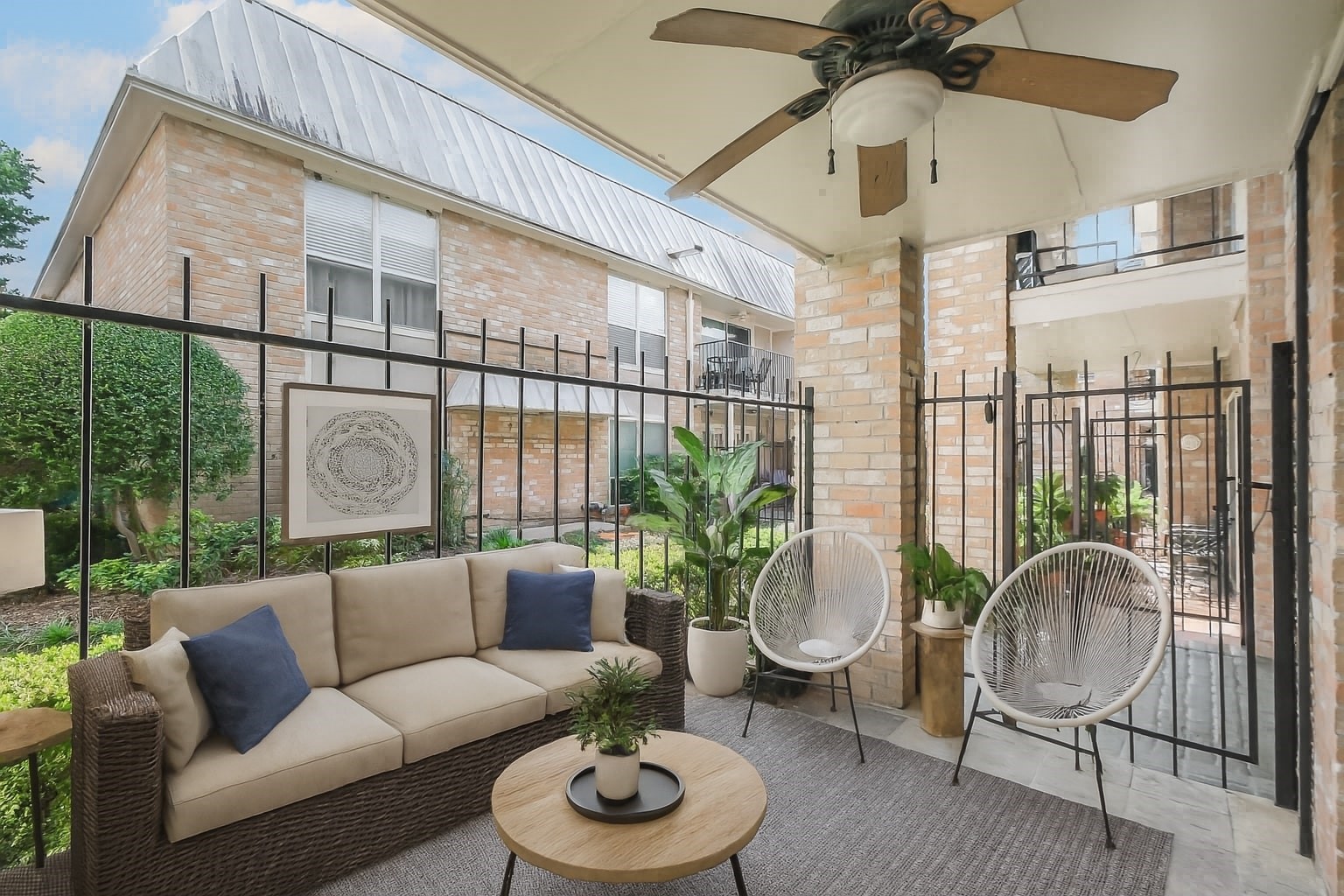 2230 South Piney Point Road, Unit 113 Houston, TX 77063 - Photo 18 of 28 A staged photo of the private patio.