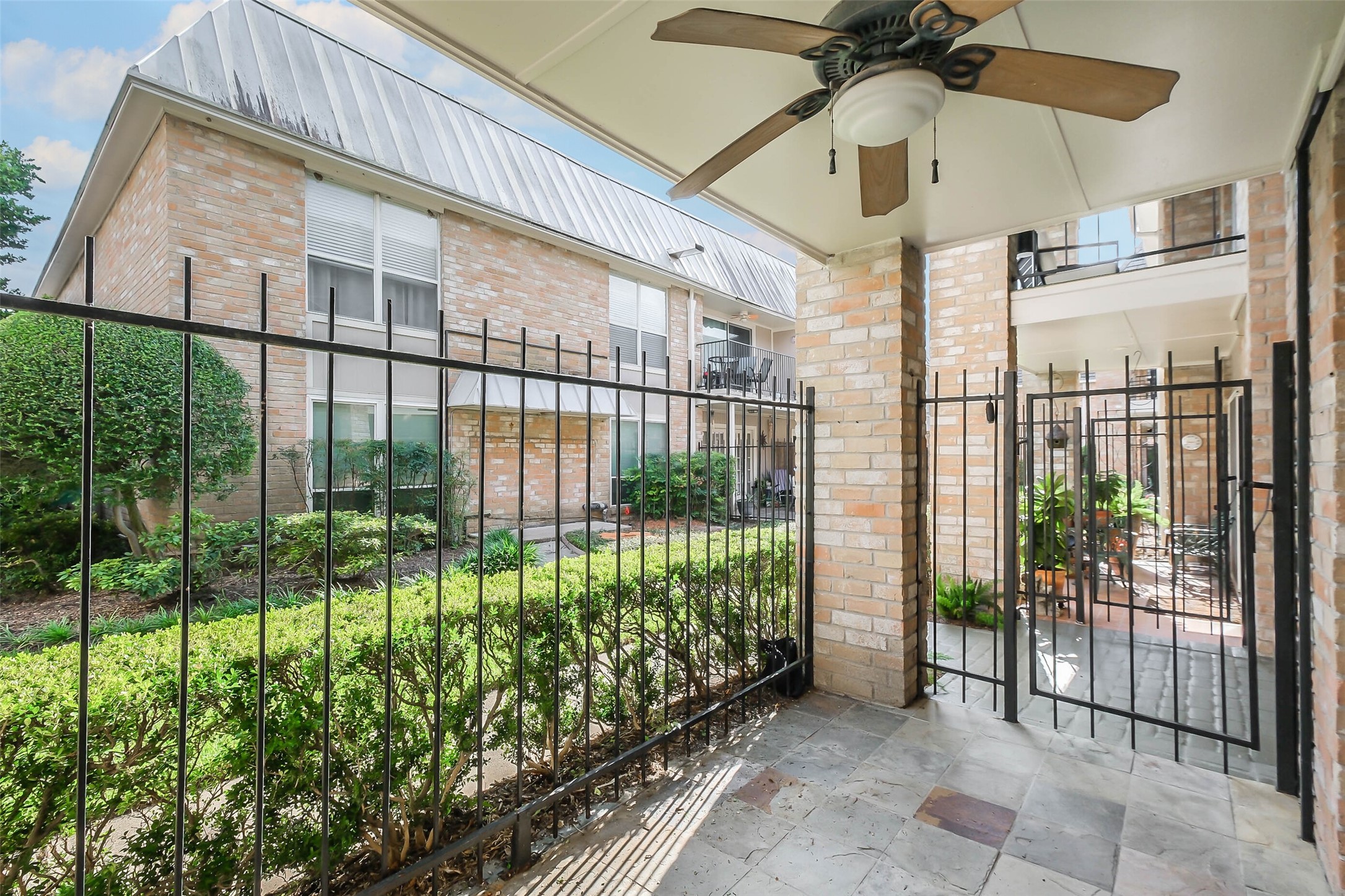 2230 South Piney Point Road, Unit 113 Houston, TX 77063 - Photo 19 of 28 The patio has a ceiling fan and faces the courtyard.
