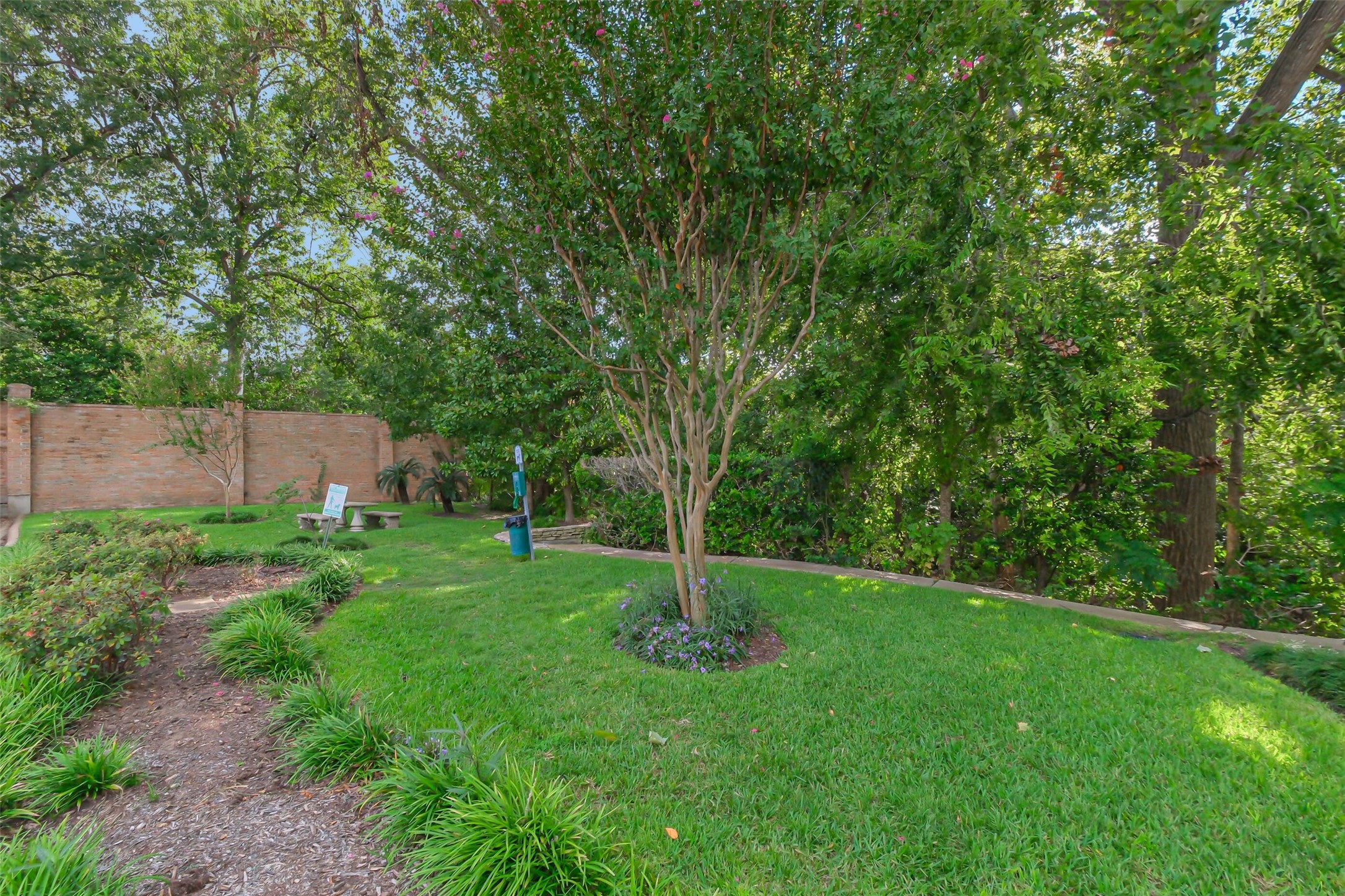 2230 South Piney Point Road, Unit 113 Houston, TX 77063 - Photo 26 of 28 There is green space to walk your dog by the community pool.
