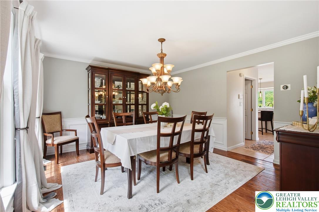 115 West Butternut Road Hellertown, PA 18055 - Photo 13 of 97 Elegant crown molding and rich hardwood flooring define this inviting dining area.