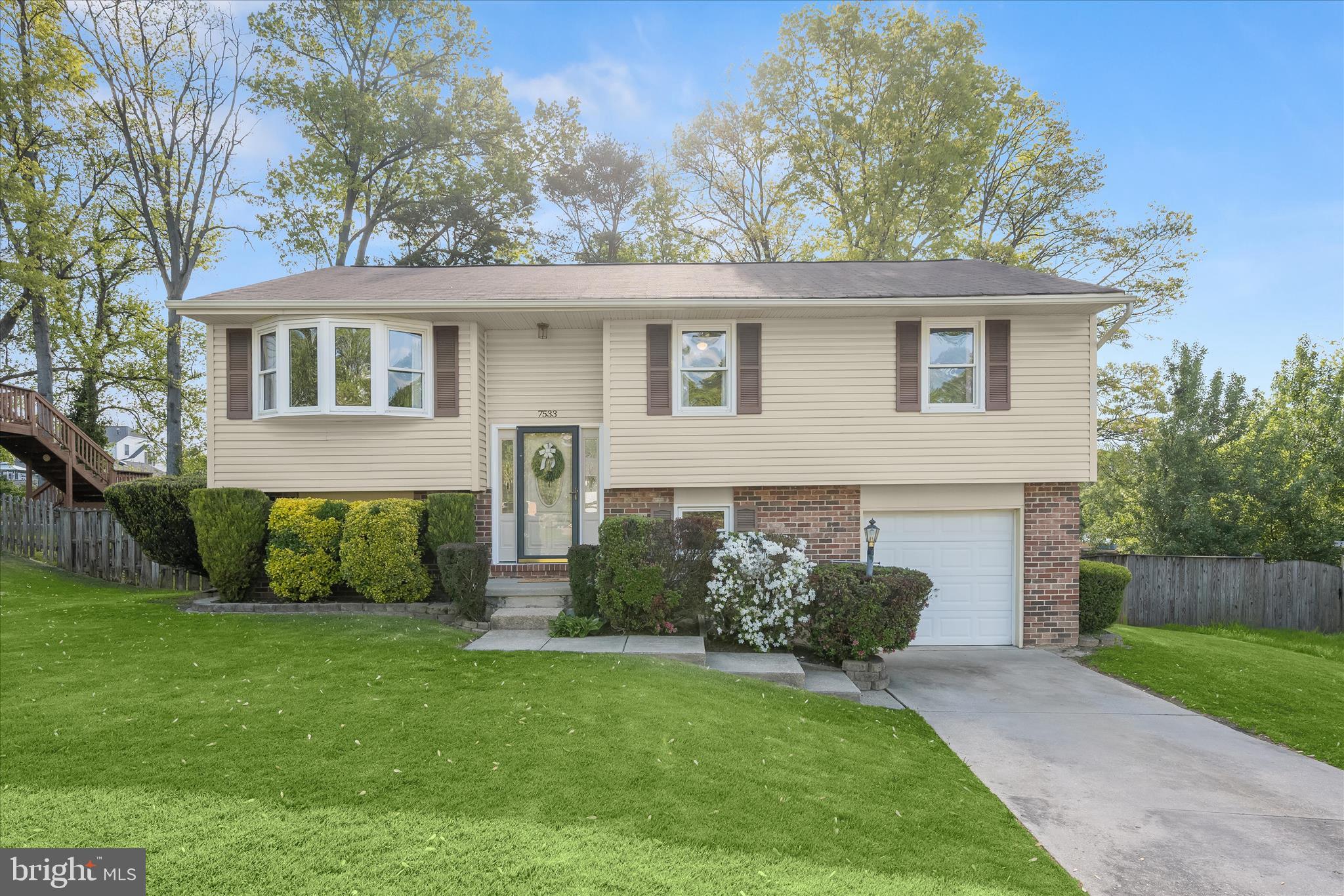 front view of a house with a yard