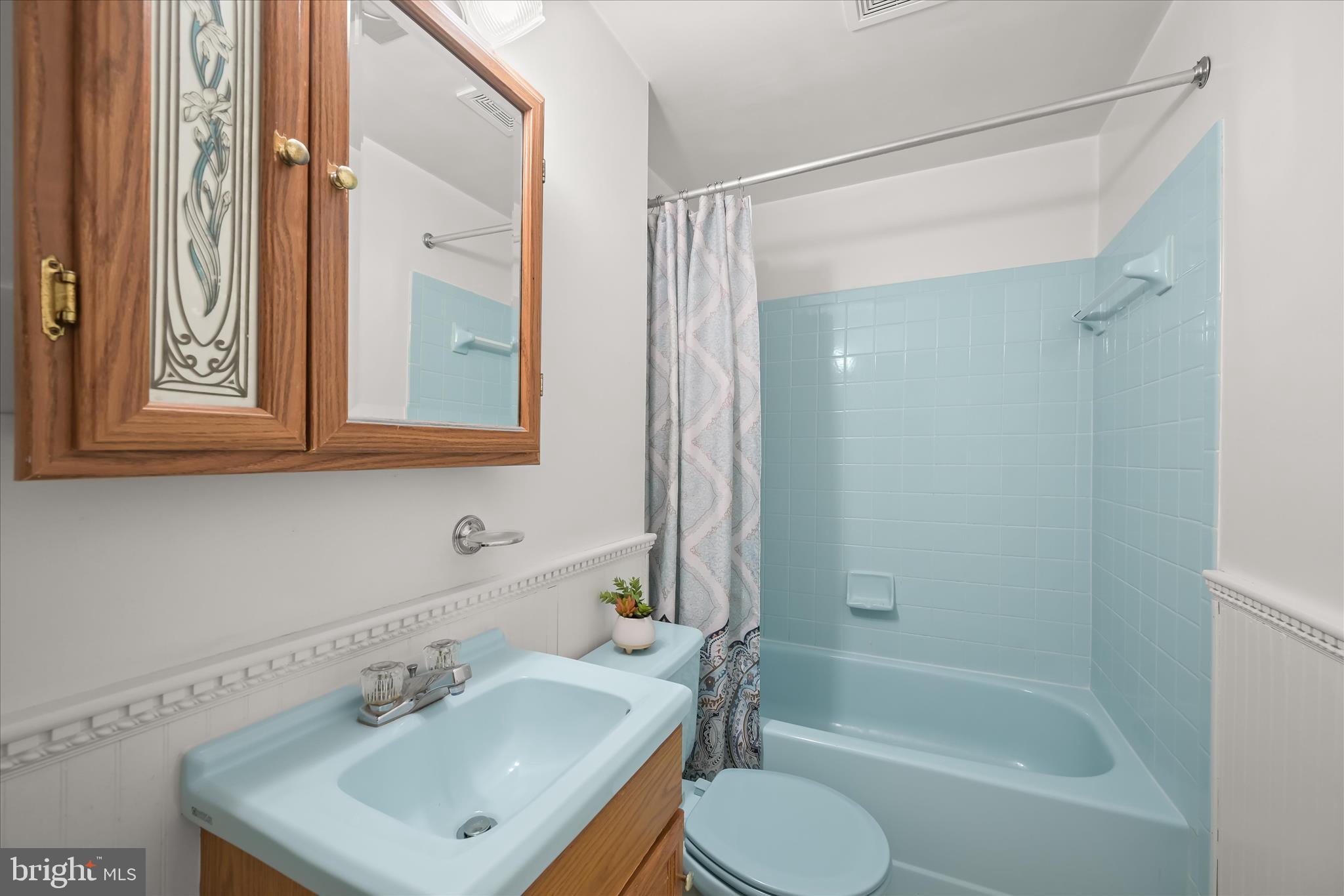 7533 Lemon Tree Court Hanover, MD 21076 - Photo 26 of 38 a bathroom with a sink toilet a mirror and shower