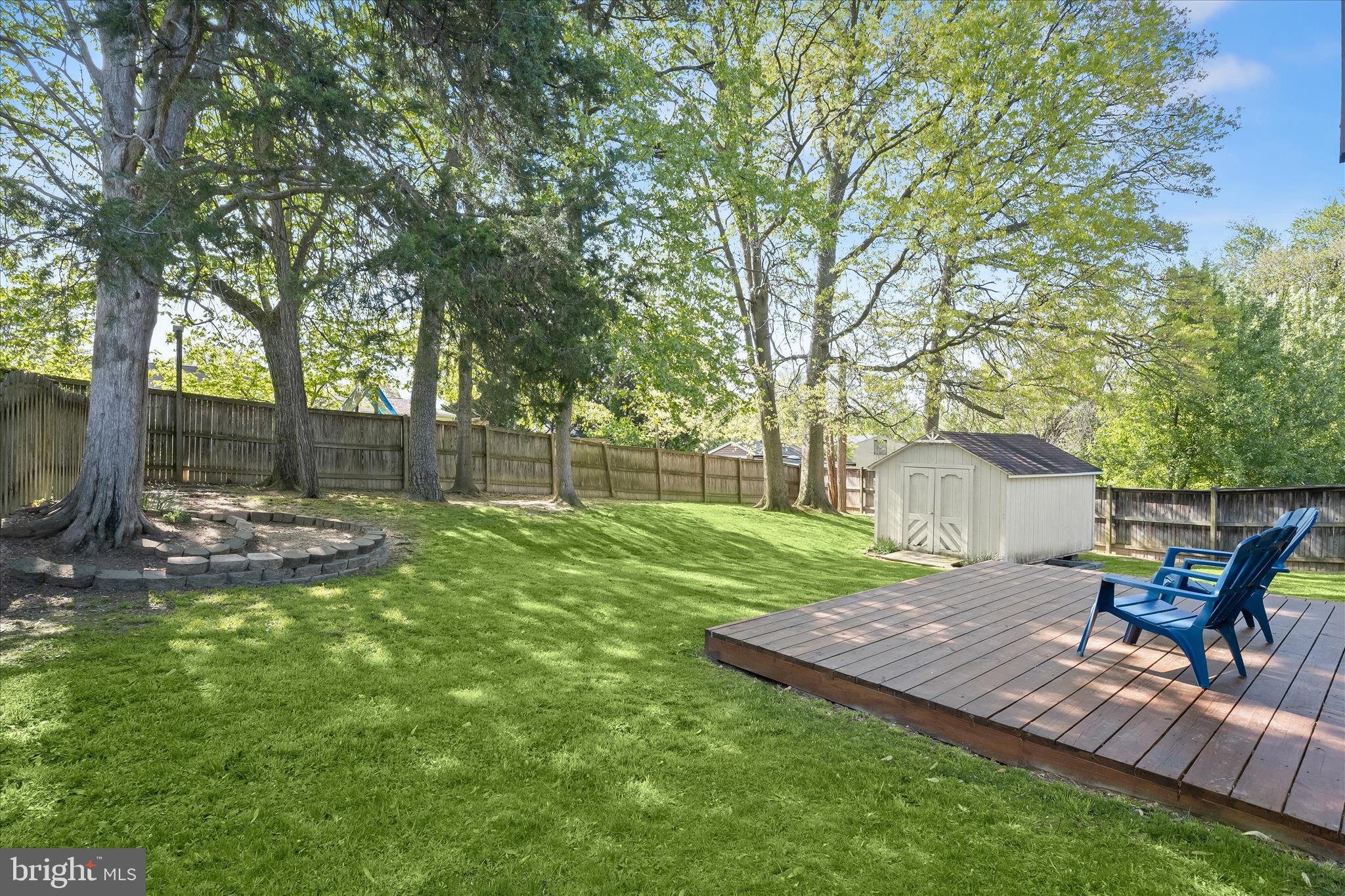 7533 Lemon Tree Court Hanover, MD 21076 - Photo 33 of 38 a view of a backyard with table and chairs and a slide