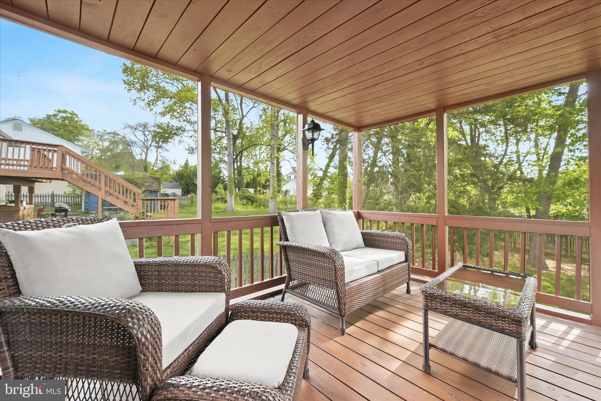 7533 Lemon Tree Court Hanover, MD 21076 - Photo 7 of 38 a balcony with furniture and wooden floor