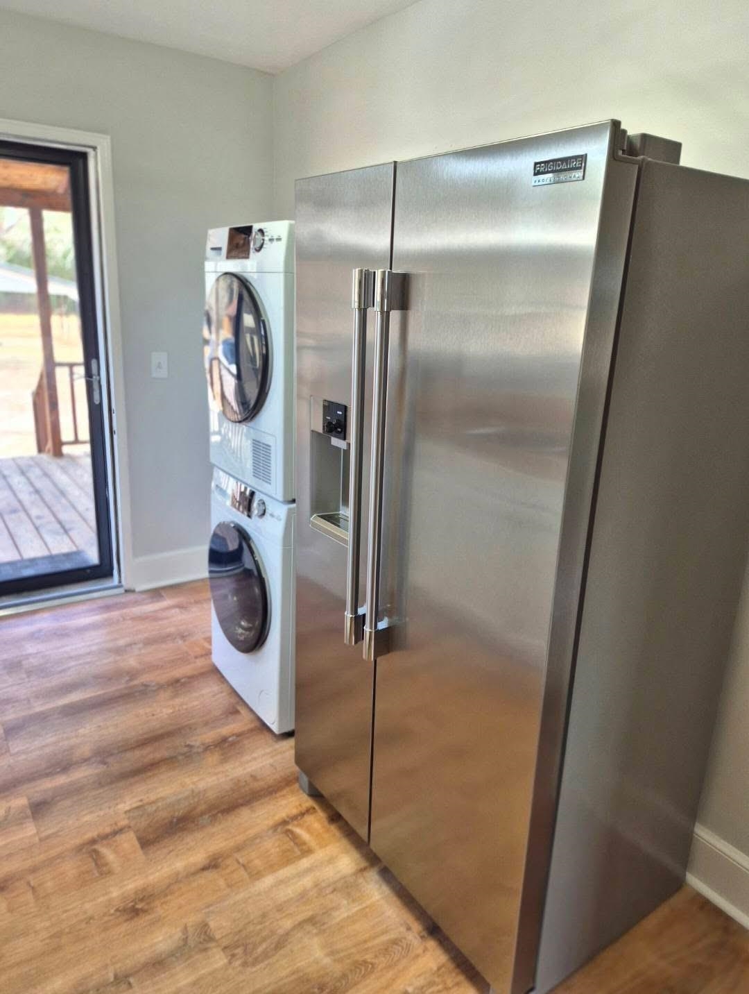 1434 Highway 57 Dillon, SC 29536 - Photo 4 of 9 Laundry room featuring light wood finished floors and stacked washer and clothes dryer