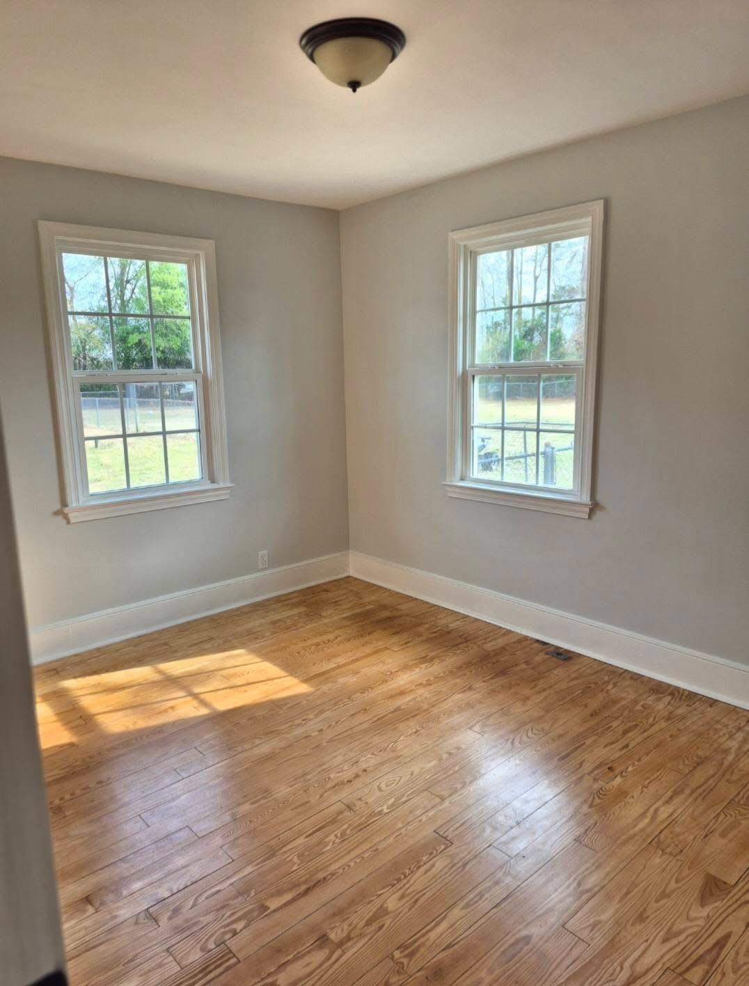 1434 Highway 57 Dillon, SC 29536 - Photo 7 of 9 Spare room featuring light wood-style floors and plenty of natural light