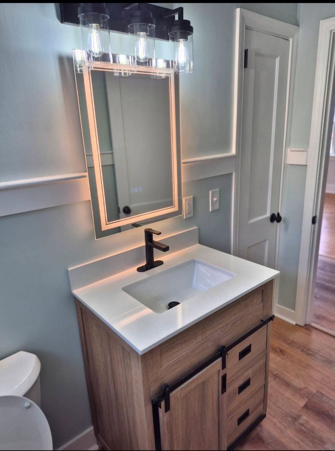 1434 Highway 57 Dillon, SC 29536 - Photo 8 of 9 Half bath featuring vanity and wood finished floors