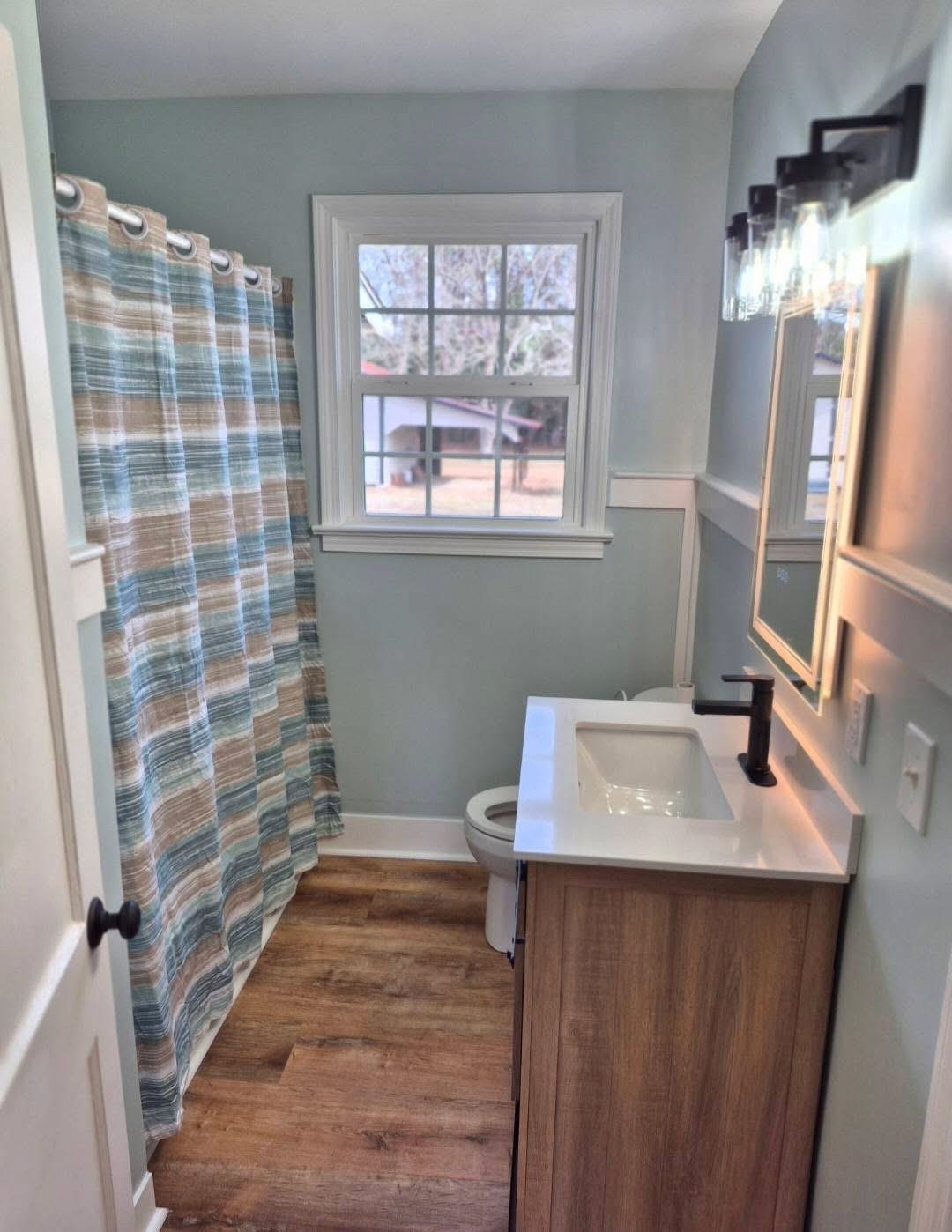 1434 Highway 57 Dillon, SC 29536 - Photo 9 of 9 Full bathroom featuring a shower with curtain, vanity, and dark wood finished floors