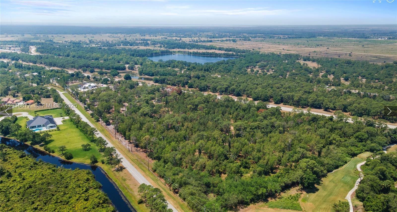 0 Unassigned Palm City, FL 34990 - Photo 1 of 2 an aerial view of residential houses with outdoor space and trees