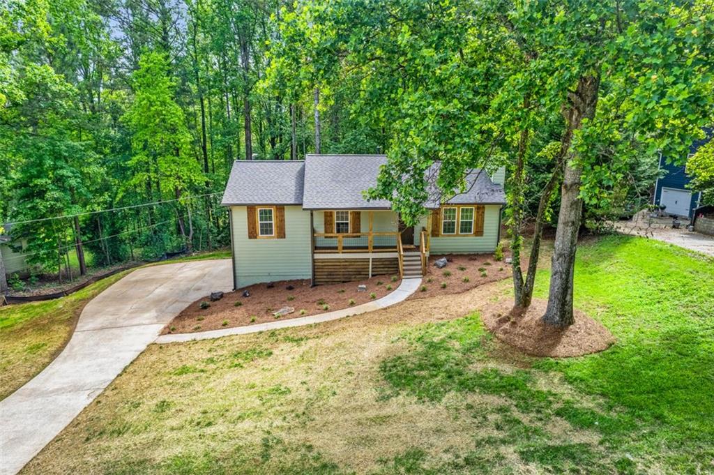 86 Williams Road Dallas, GA 30132 - Photo 1 of 1 a view of a house with a yard