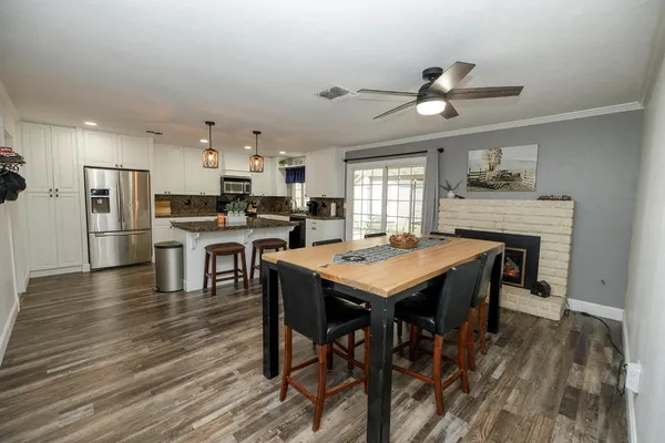 a kitchen with a table and chairs in it