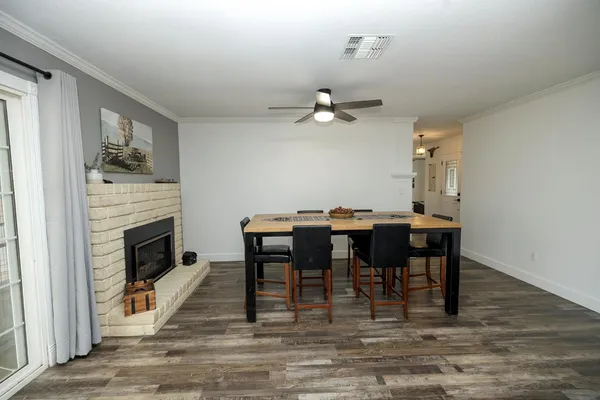 a view of a livingroom with furniture and a fireplace