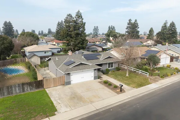 an aerial view of residential houses with outdoor space