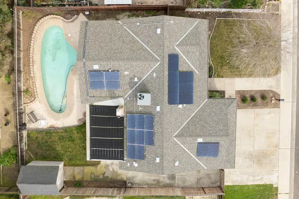 a aerial view of a house with a swimming pool
