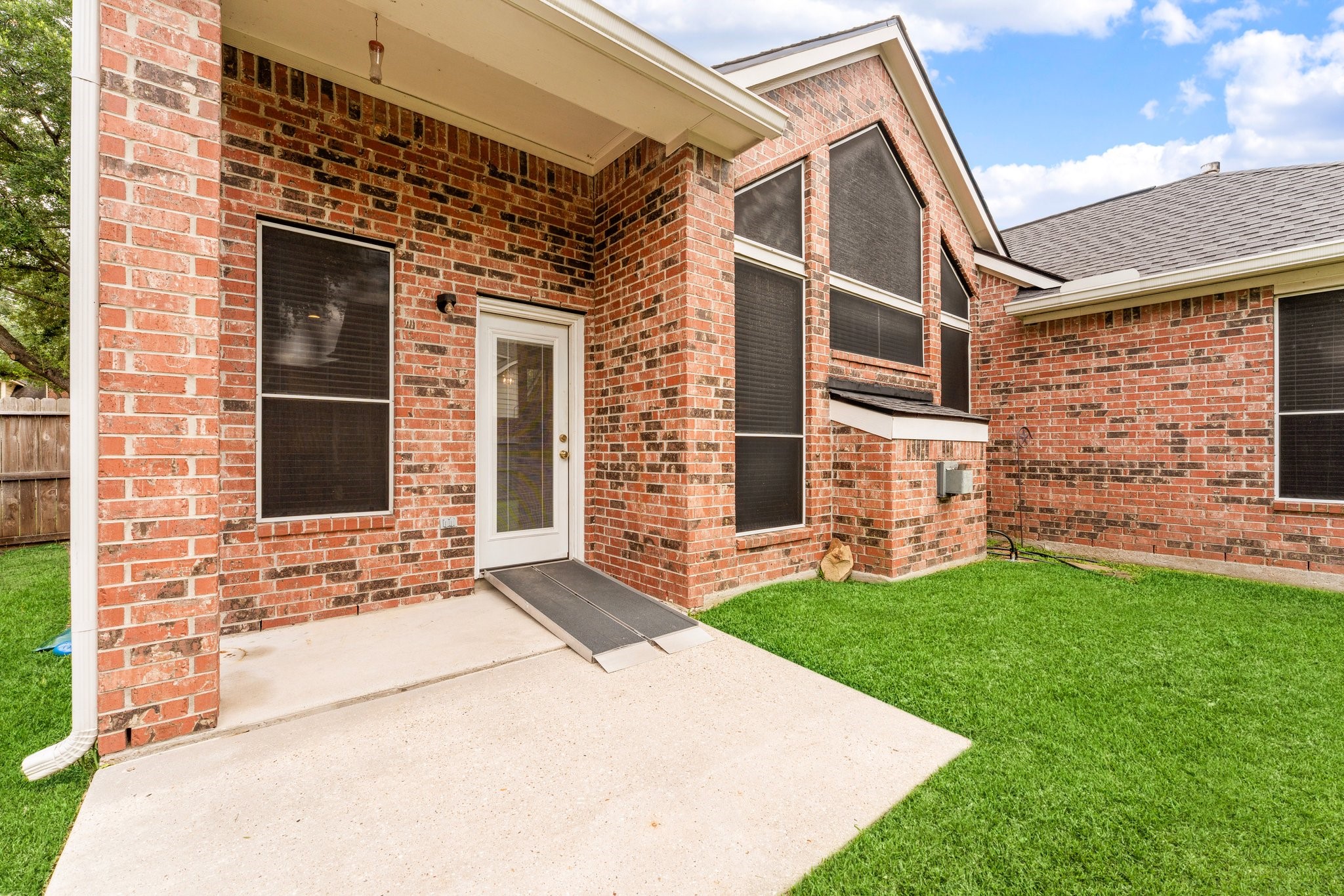 25447 China Springs Spring, TX 77373 - Photo 32 of 45 Overlooking the spacious backyard and beautiful mature trees, the covered patio provides a comfortable place to enjoy morning coffee, evening conversations, and the peaceful place that makes this outdoor space special.