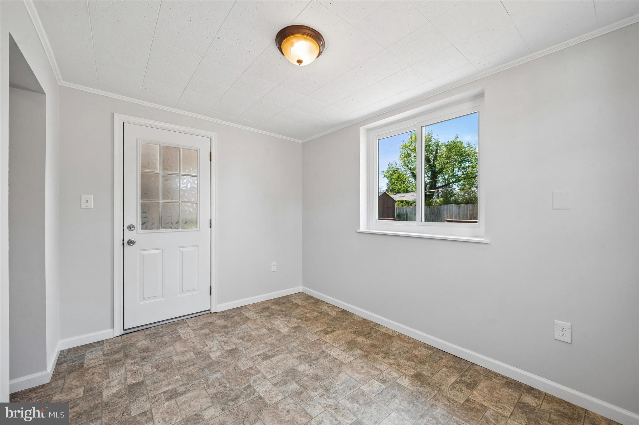 2154 Sproul Road Broomall, PA 19008 - Photo 15 of 25 an empty room with a window