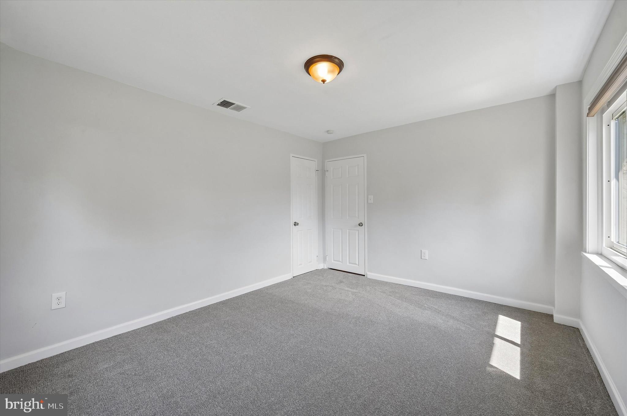 2154 Sproul Road Broomall, PA 19008 - Photo 20 of 25 a view of an empty room with a window