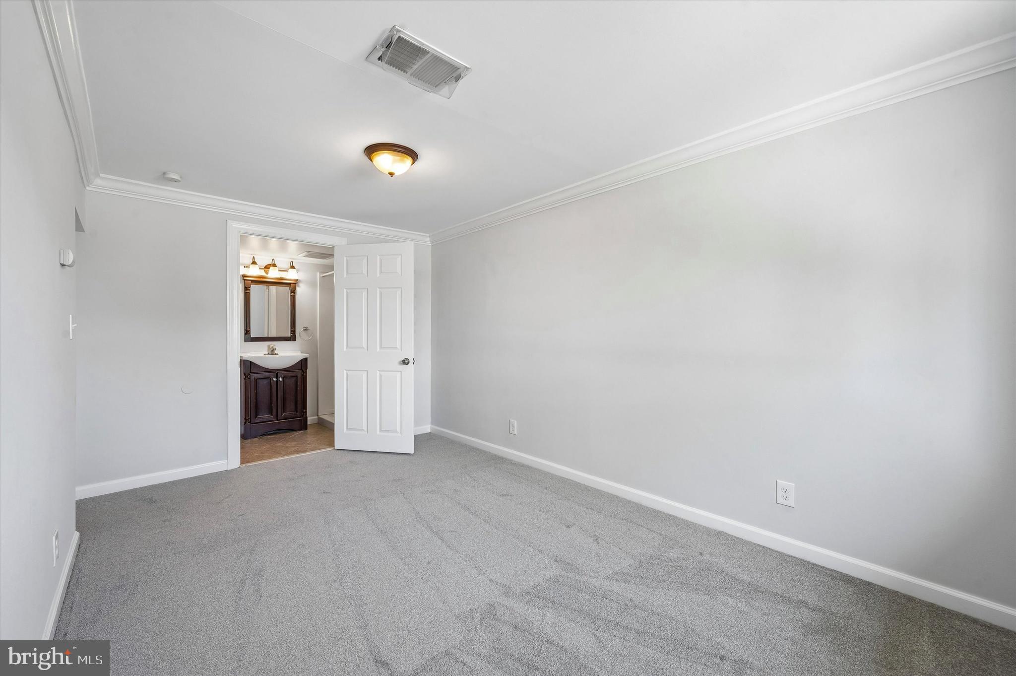 2154 Sproul Road Broomall, PA 19008 - Photo 7 of 25 a view of an empty room with a window