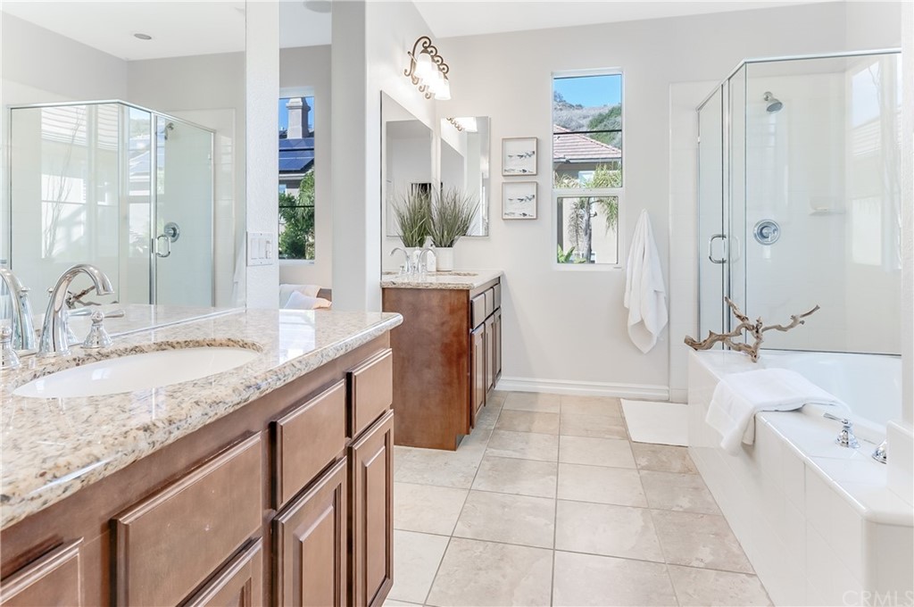 20 Paseo Canos San Clemente, CA 92673 - Photo 32 of 71 a spacious bathroom with a granite countertop tub sink and mirror
