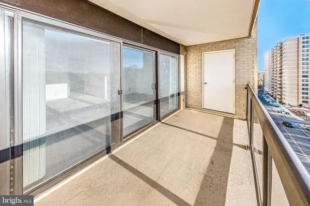 a room with a bed and cabinets