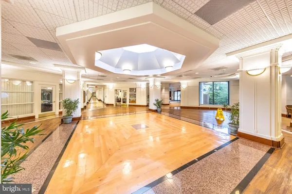 a view of a hallway to a livingroom and furniture