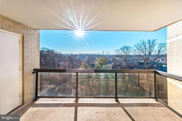 a view of a living room with a large window