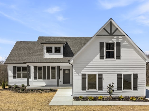 6120 Red River School Road Portland, TN 37148 - Photo 1 of 26 a front view of a house with a yard
