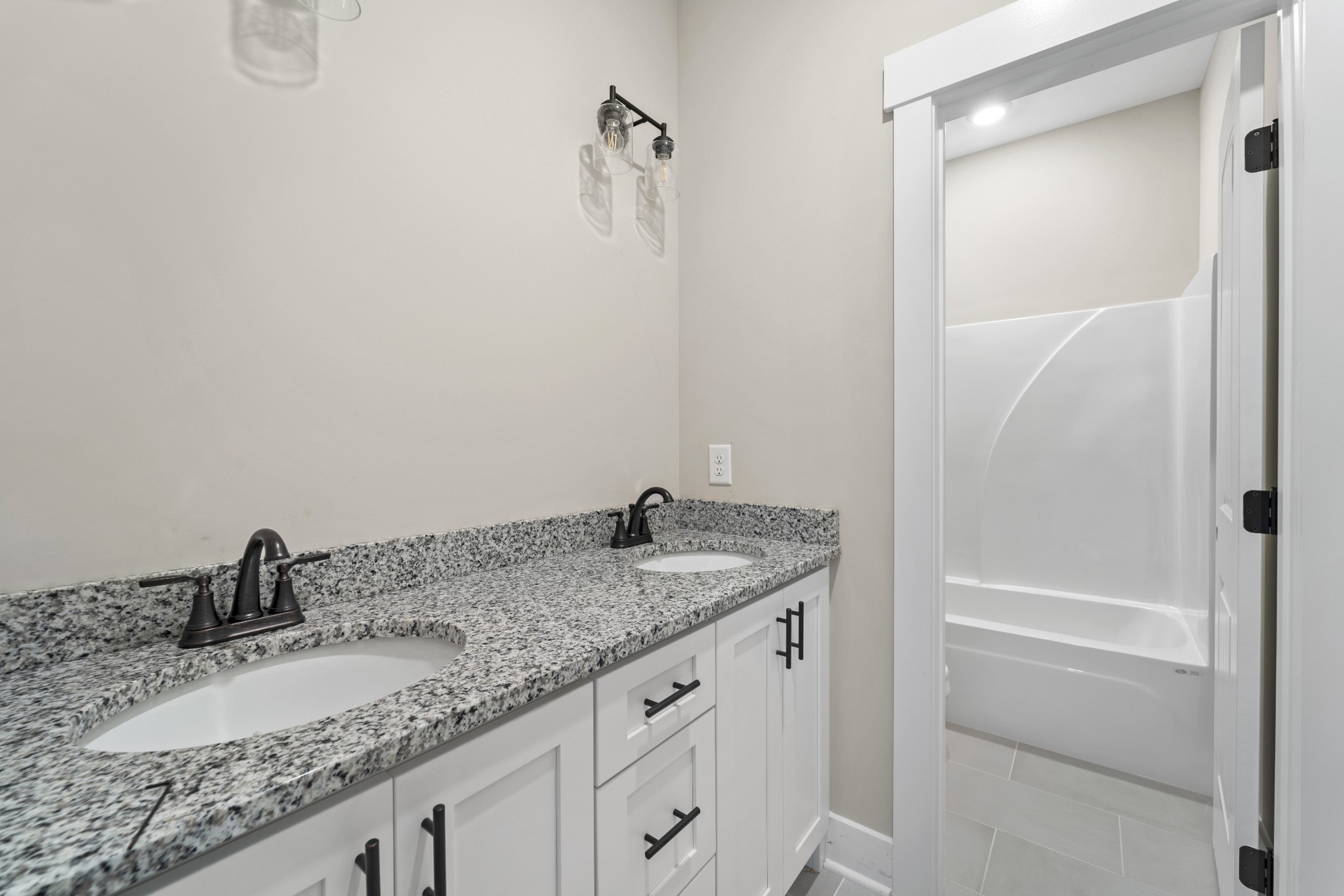 6120 Red River School Road Portland, TN 37148 - Photo 24 of 26 a bathroom with a granite countertop sink and a mirror