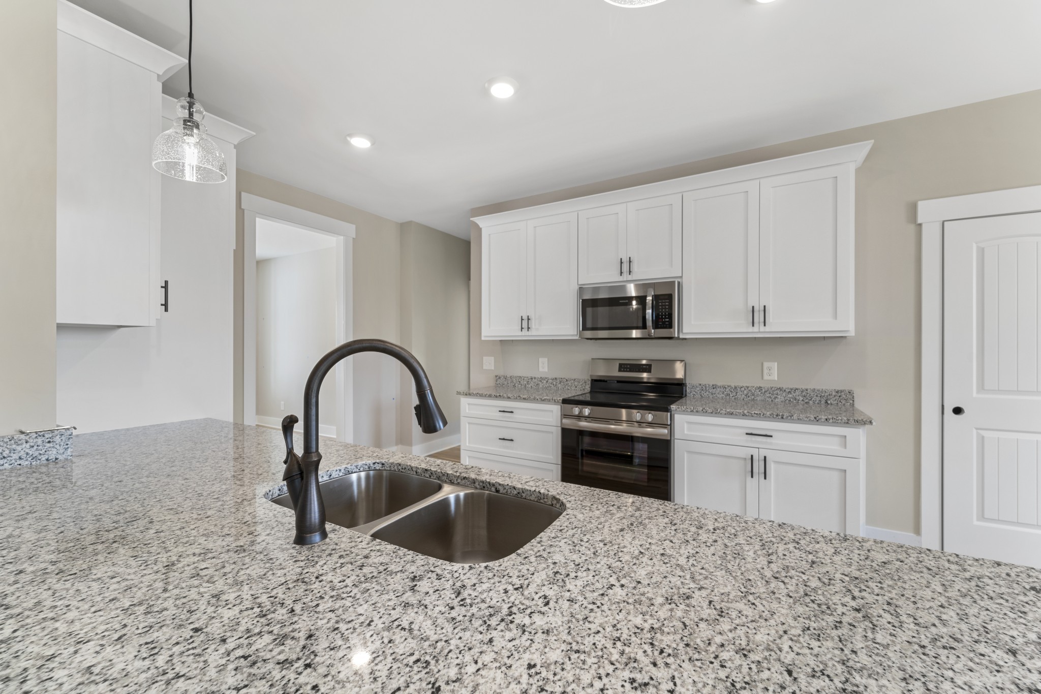 6120 Red River School Road Portland, TN 37148 - Photo 4 of 26 a kitchen with stainless steel appliances granite countertop a sink a stove and refrigerator