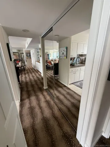 a spacious bedroom with a bed and a large window