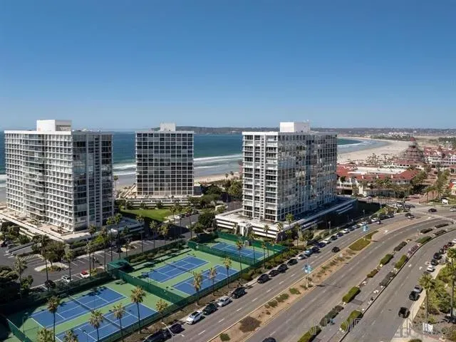 an aerial view of ocean and city