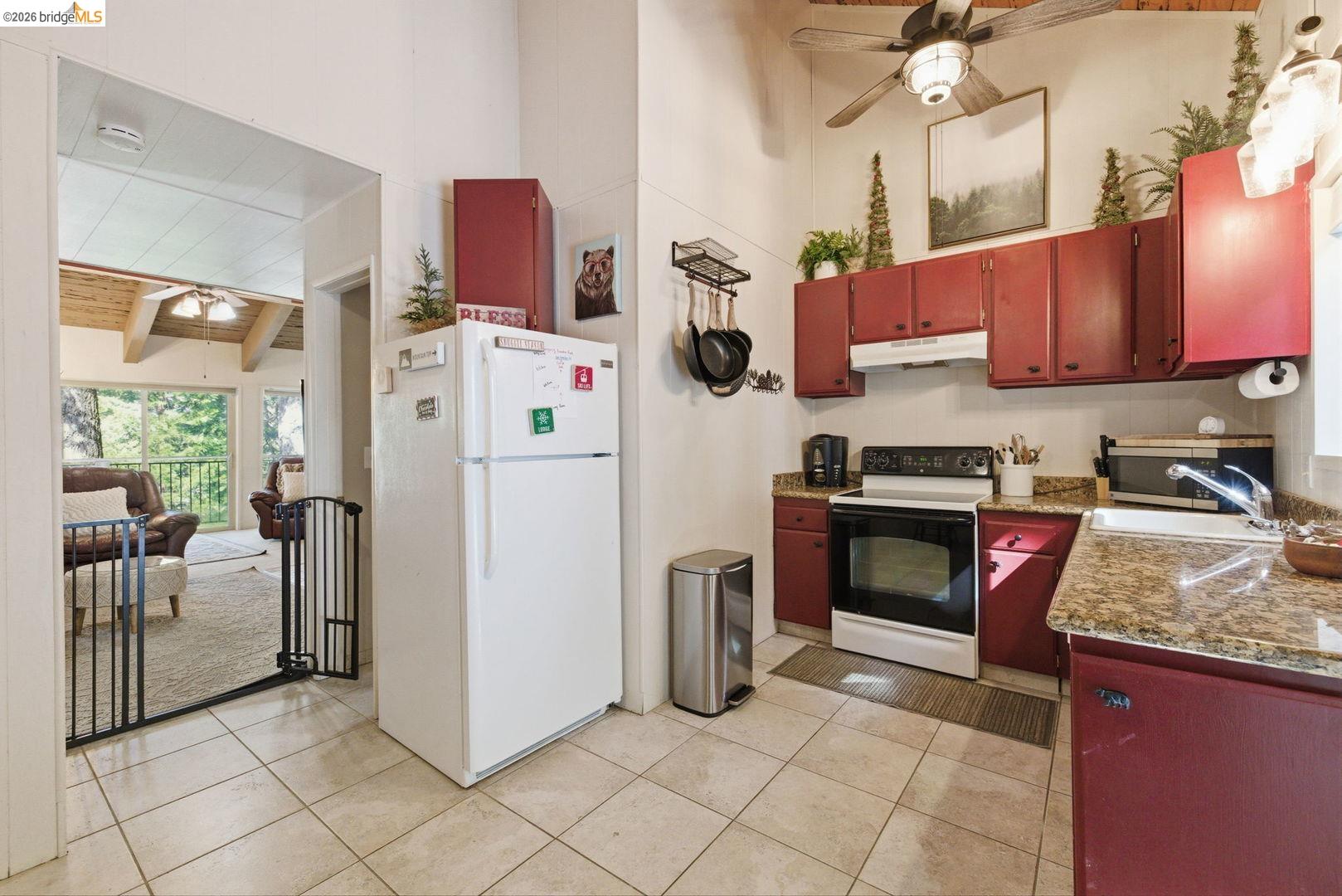 33840 Upper Leland Road, Unit 25A Pinecrest, CA 95364 - Photo 10 of 41 a kitchen with stainless steel appliances granite countertop a refrigerator a stove a sink and dishwasher
