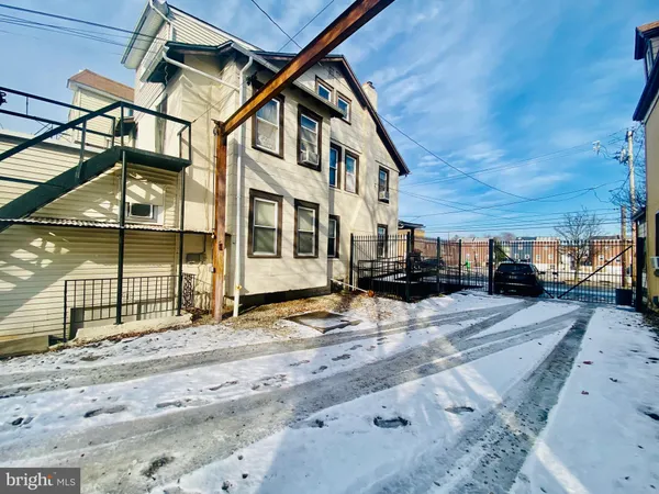 a view of a street with a house